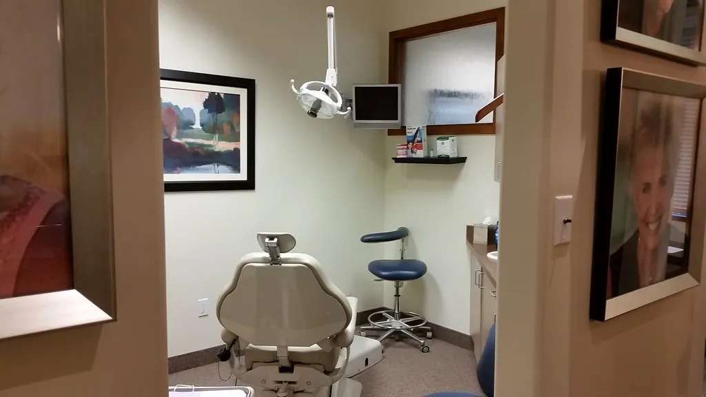 27001 dentist examining gums