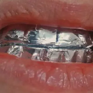 /img/27070-teeth-whitening-tin-foil-smile.webp